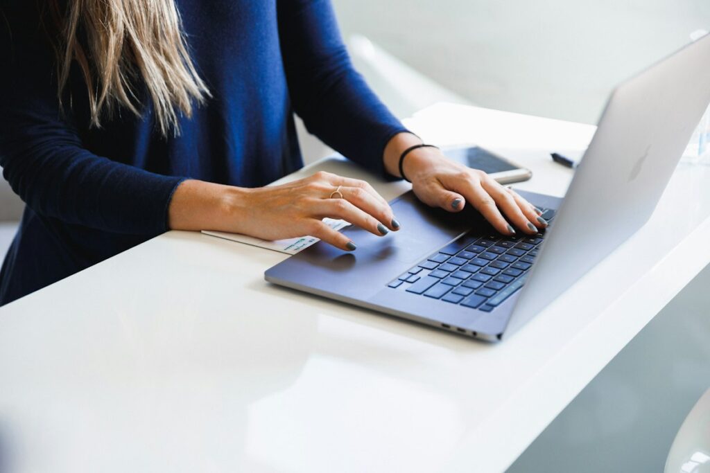 Professional checking business email on a laptop