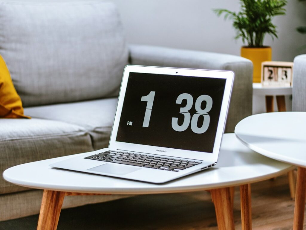 Laptop on a desk used to manage a website domain name and web hosting