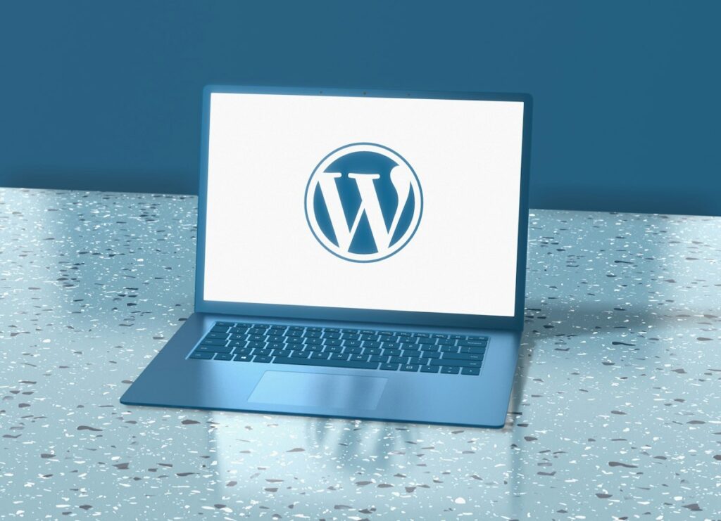 Laptop on a desk showing a website, illustrating how to register a .pk domain name