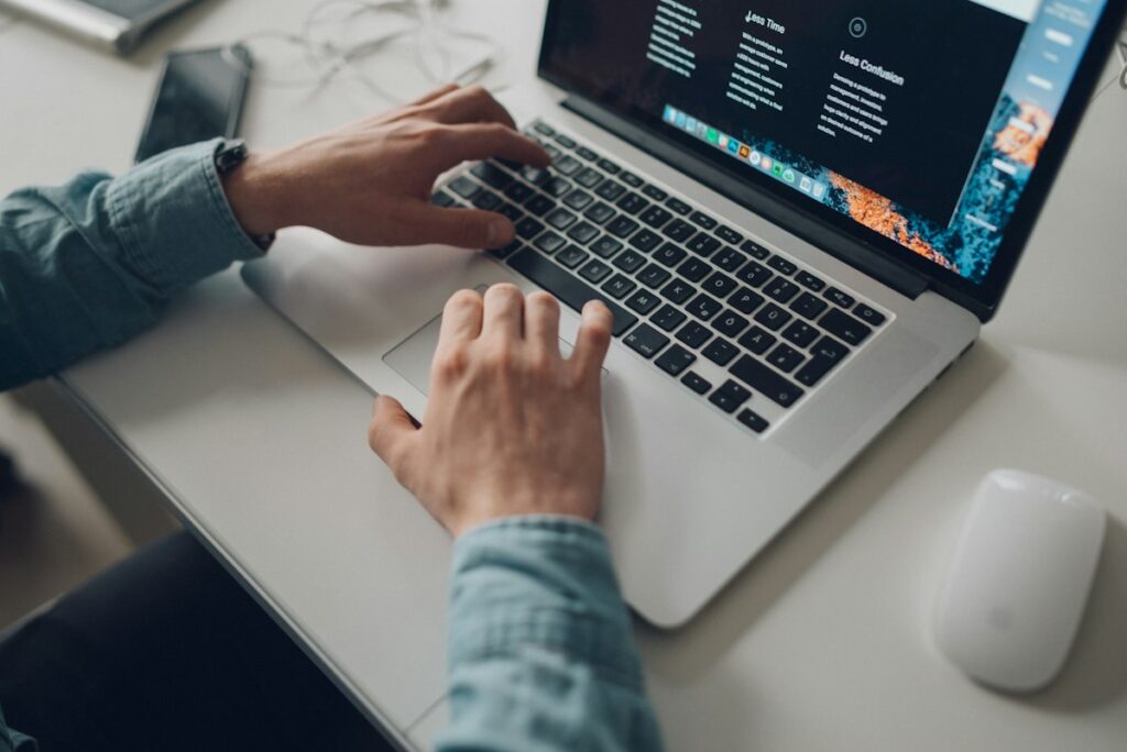 Person working on a laptop installing WordPress